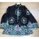A black kimono style jacket, 1930's decorated with stork type birds,