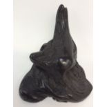 An Irish bog oak "sculptrue" estimated 5,600 years old, smoothed, with beeswax finish,