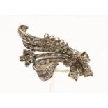 An early 20th century diamond and platinum stylised spray brooch,