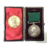 A cased Victorian Volunteer Long Service medal complete with ribbon. Unamed example.