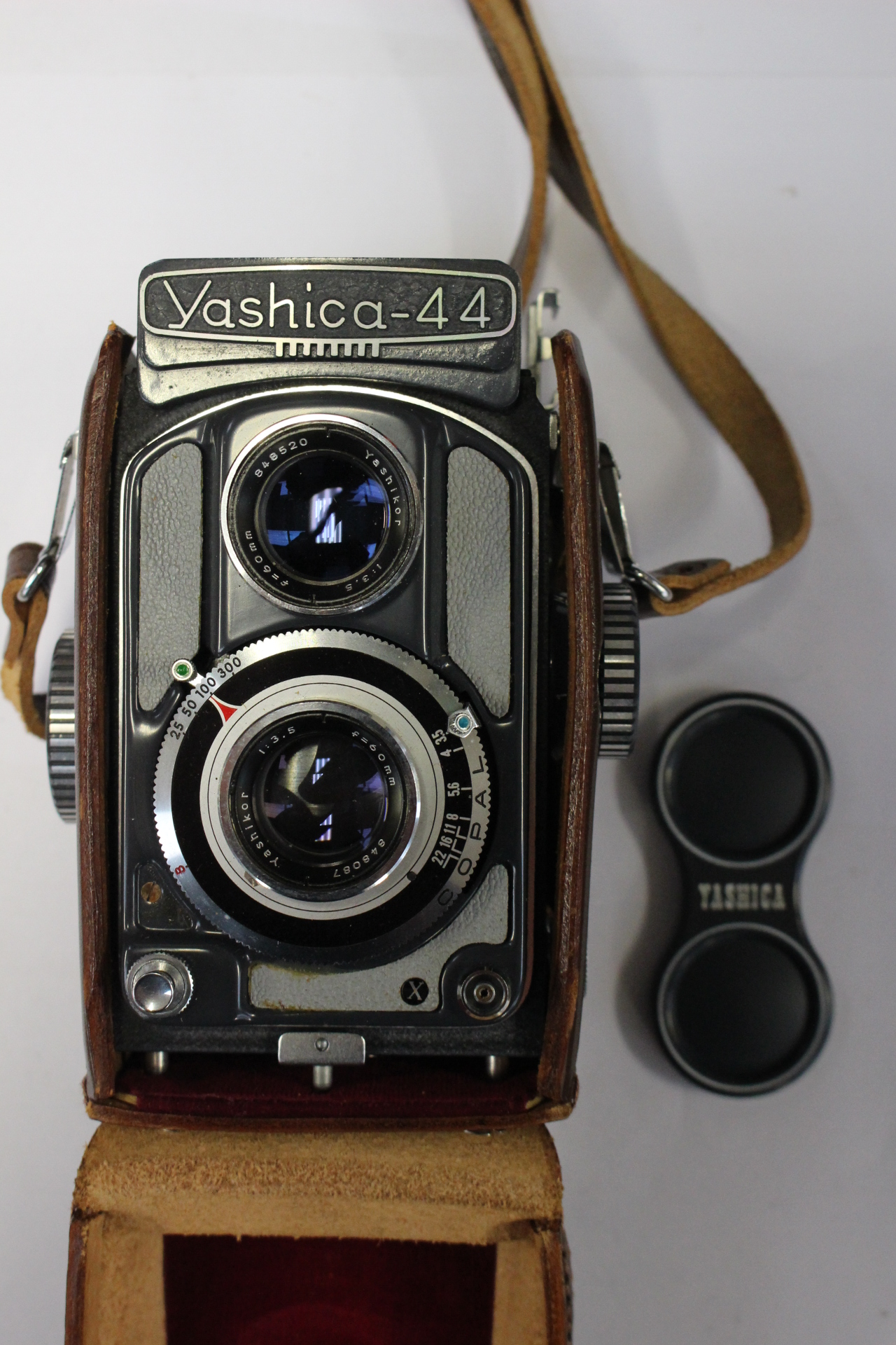 A Yashica 44 cm camera in brown leather case with instruction booklet,