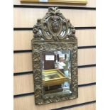 A continental gilt mirror, c 1900 with bevelled edge plate,