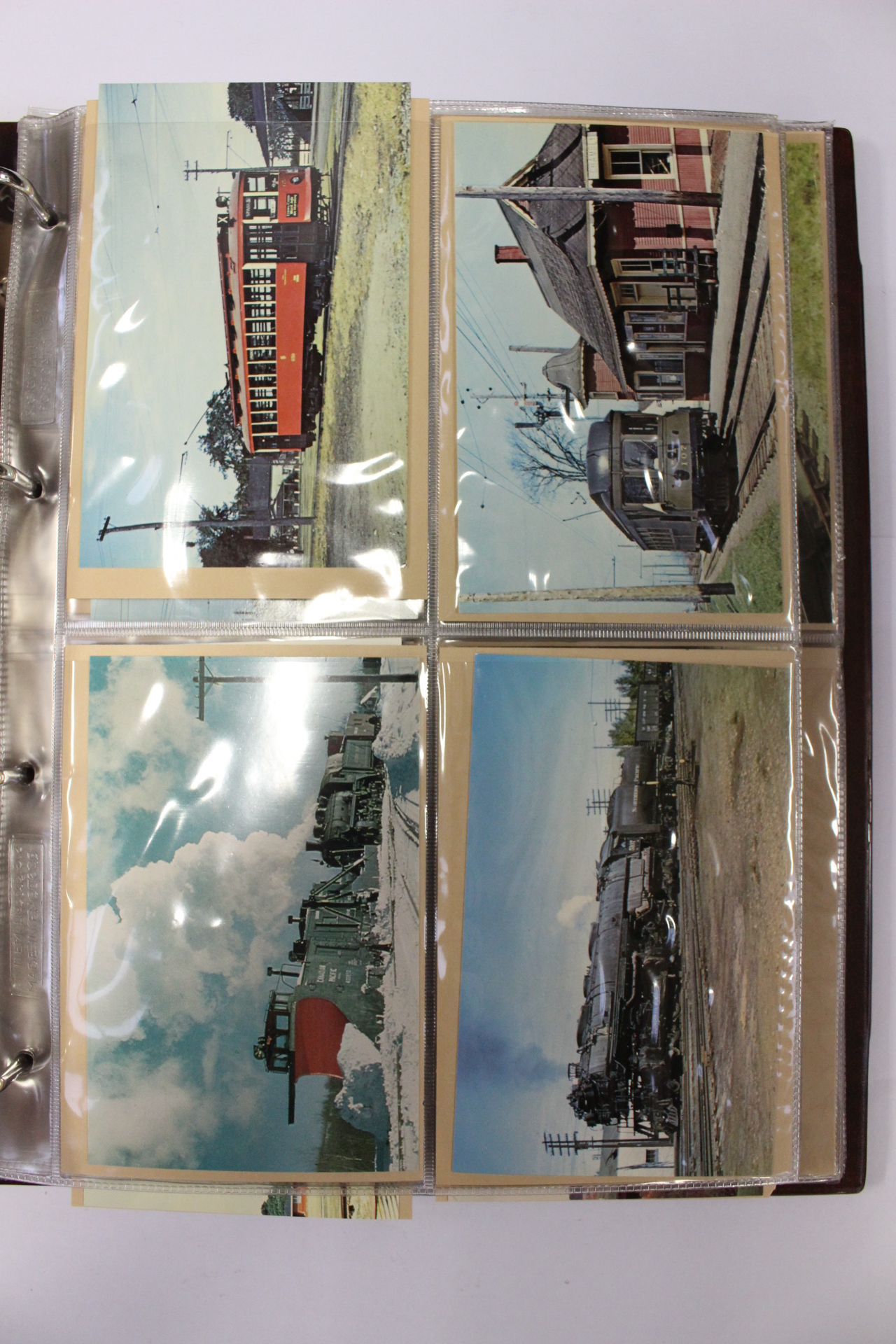 Railway memorabilia; two Stanley Gibbons post card albums,