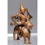 DURGAbronze,Nepal, 16th century,H: 10 cmIt is eight armed Dura sitting astride her vahana, lion. A