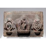 VISHNUstone,Nepal, 16th century,H: 10,5 cmeVishnu flanked by two feet, to the right a conch and to