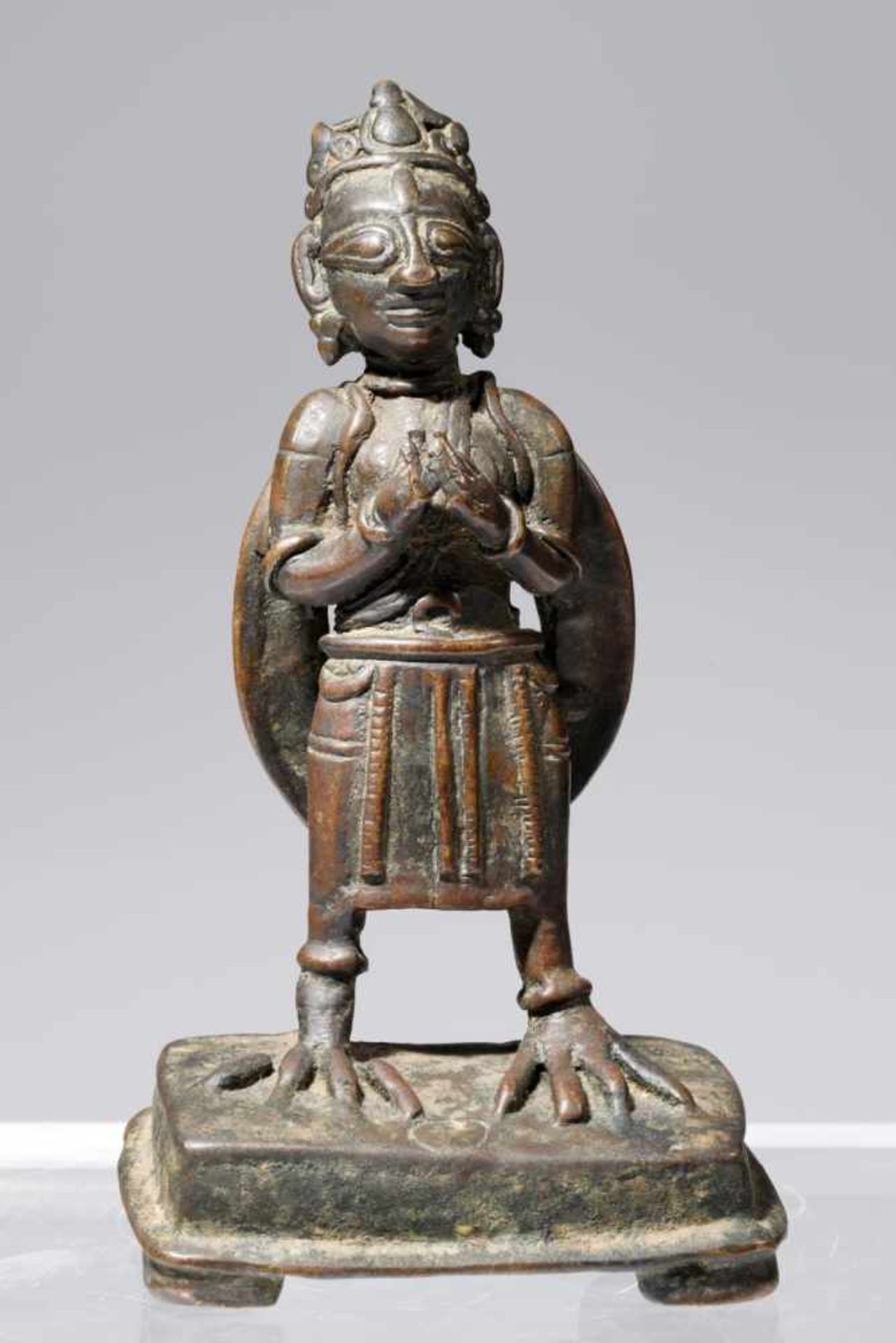 STANDING GARUDABronzeIndia, 17th Century H: 15 cmRare standing Garuda, both hands in front of his