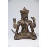 VISHNUbronze,Khmer, 14th centuryH: 22 cmVishnu sitting in lotus position, his four arms holding