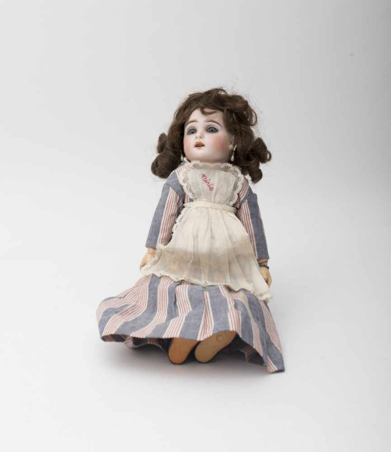 Doll With biscuit head, open mouth, based on a JUMEAU mould, branded “4”, fixed blue eyes,