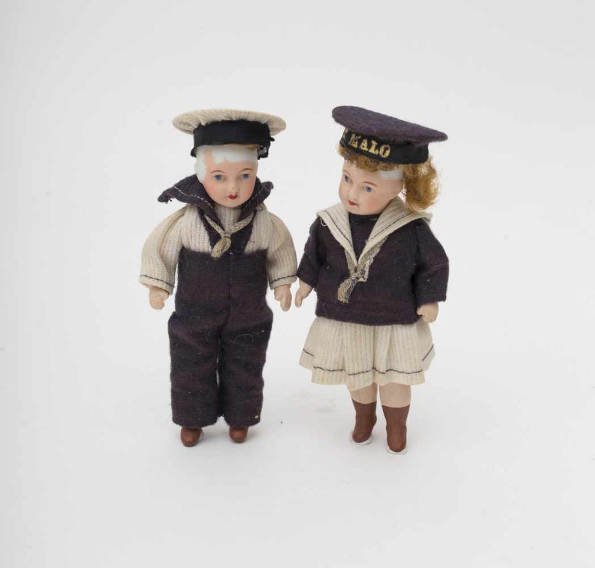 Couple of dolls UNIS France, with biscuit head and composition body, sailor’s outfits, “ST MALO” “