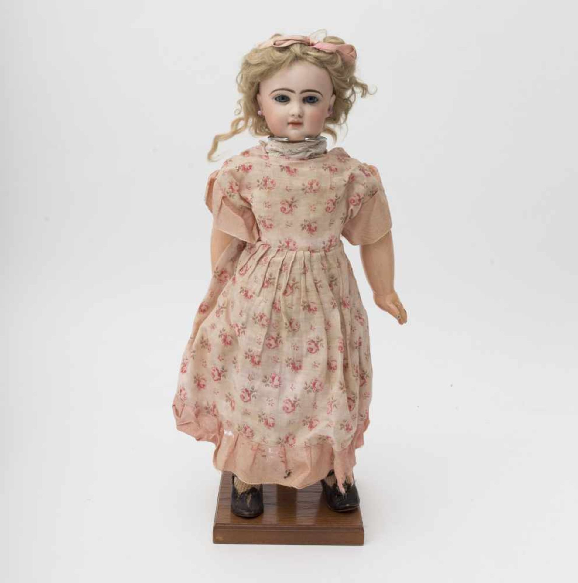 French baby doll At the “PRINTEMPS” store in Paris, with cast biscuit head, closed mouth, engraved