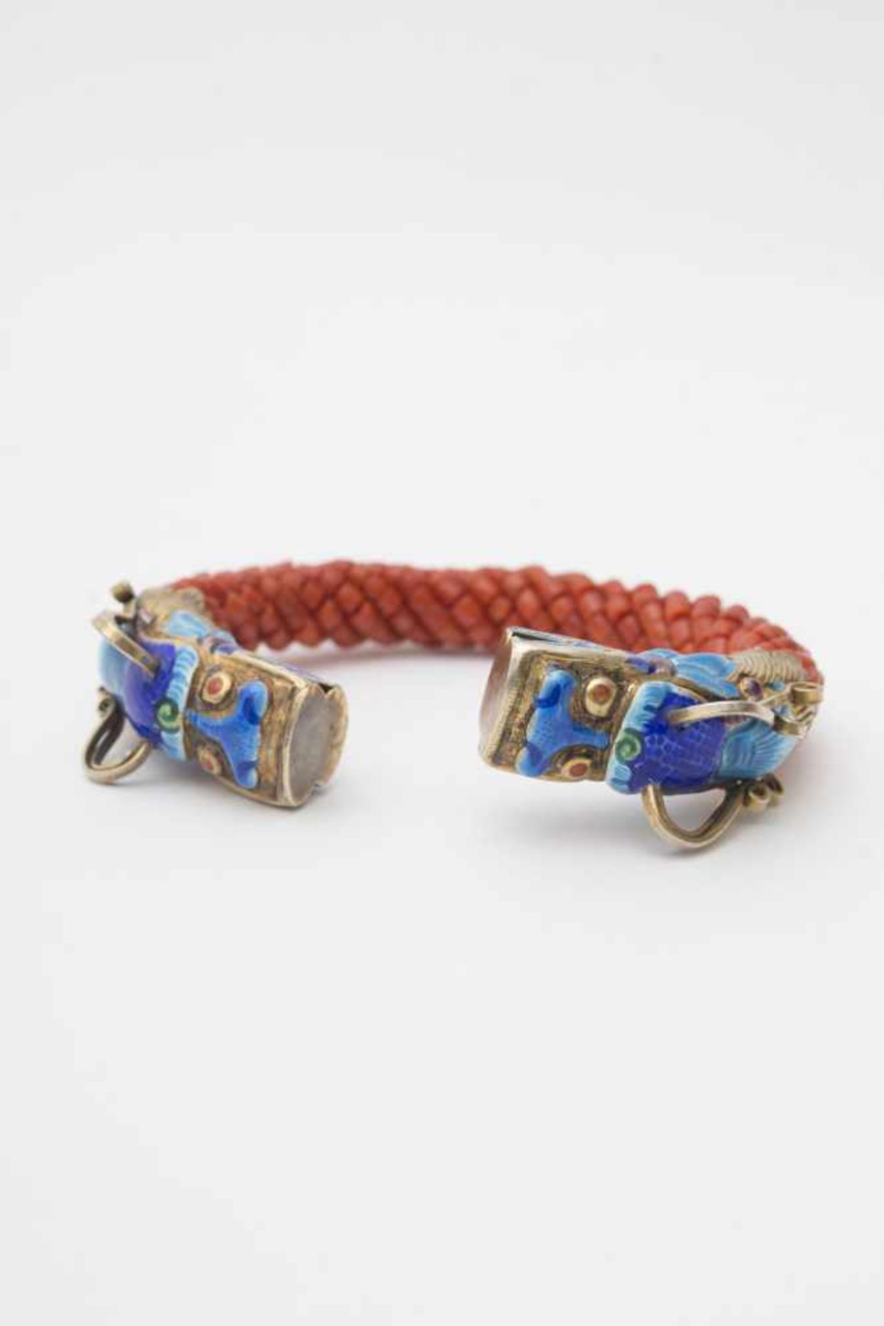 Coral bracelet - China, 20th century Rigid, semi-open, composed of twisted strands of coral beads,