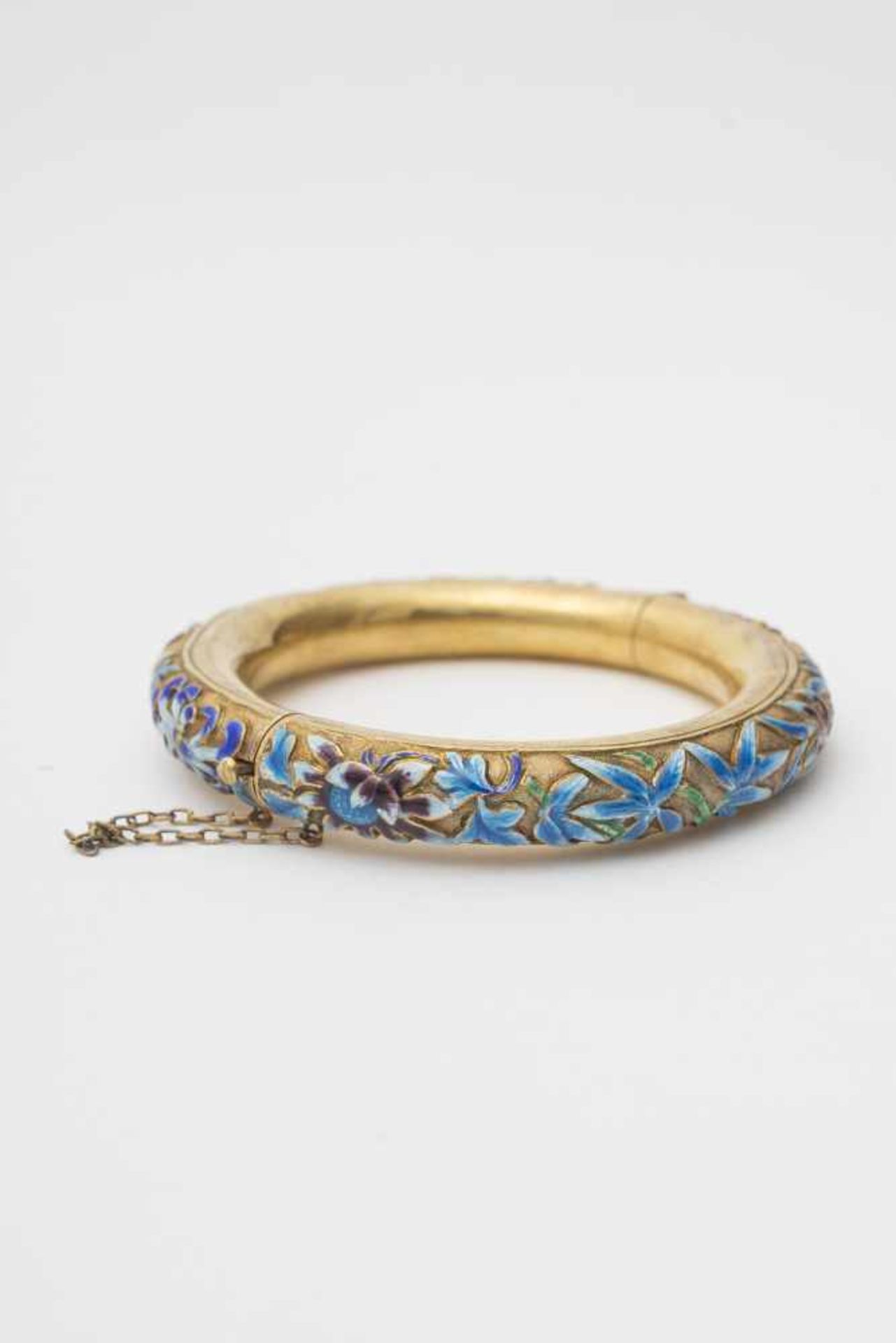 Bangle - China, 20th century Gilded silver, adorned with blue, green and violet enamel floral