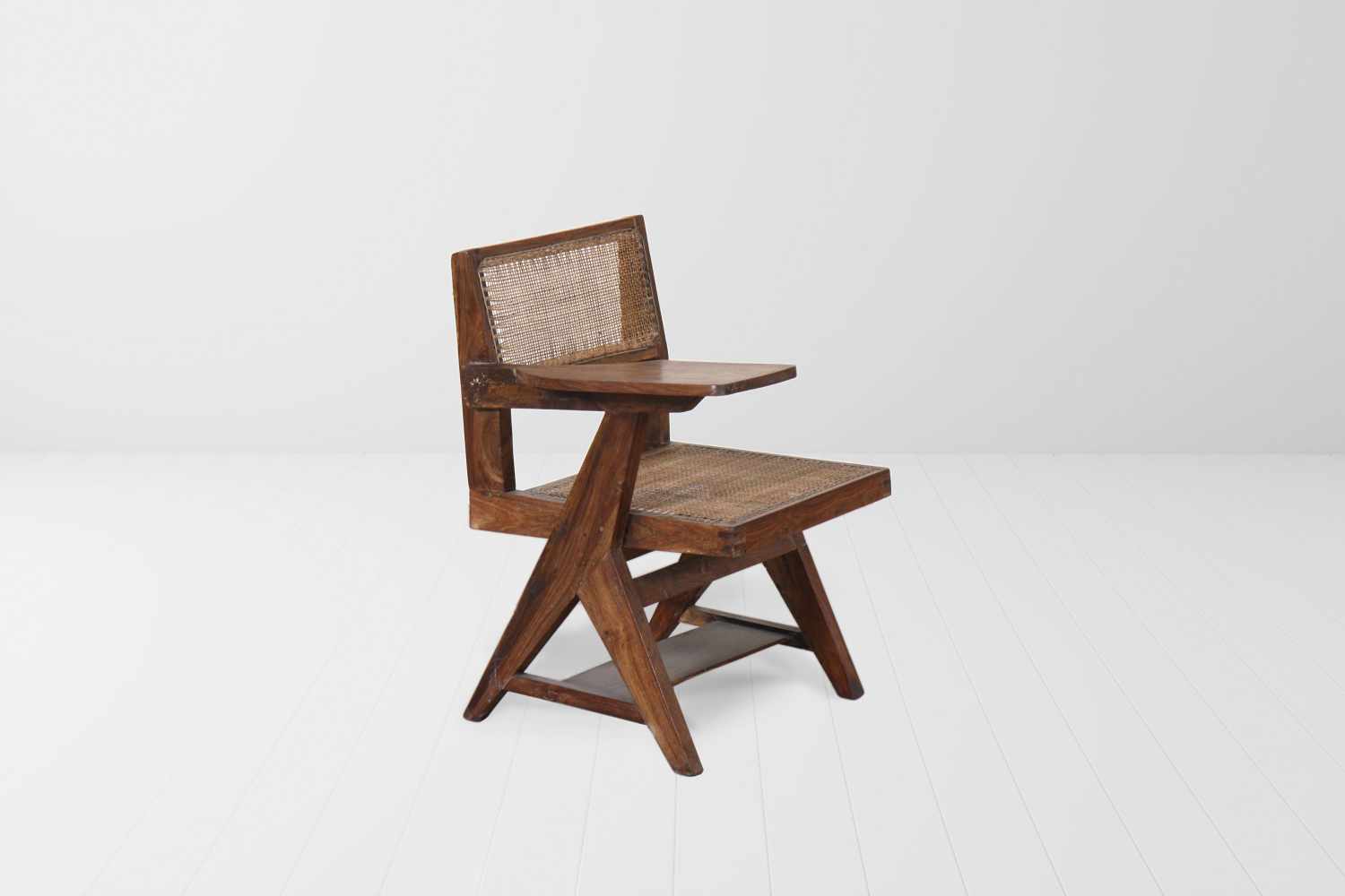 Pierre Jeanneret (1896-1967) Student's chair, 1955 Teakwood and cane chair with inverted Y-shaped