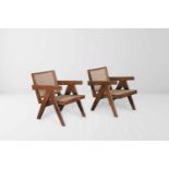 Pierre Jeanneret (1896-1967) Easy Armchairs, 1955 Pair of teakwood and cane chairs. Inclined backs