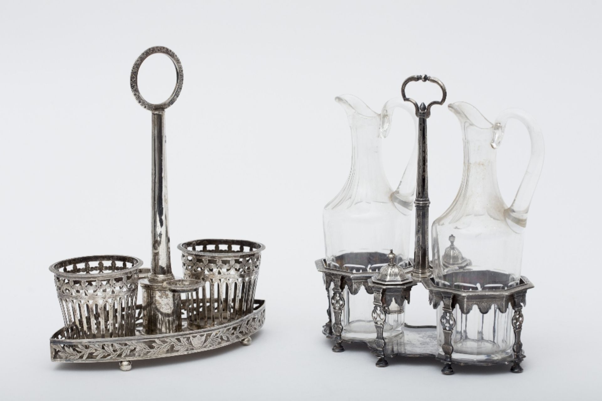 Set of two cruets Silver. One from Louis XVI period, with an engraved silver fretwork base, with