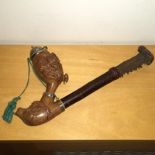 Large Carved Wooden Three Piece Pipe. Carved end in the form of a rams head supporting a