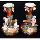 Large Pair Of Antique Majolica Vases, Encrusted With Floral Decoration Depicting A Boy And Girl