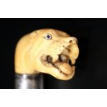 Carved Ivory Topped Walking Cane Realistically Modelled In The Form Of A Wild Cat With Glass Eyes