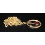 Gold Continental Pendant, Oval Form Set With A Red Ruby Coloured Stone