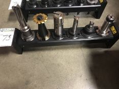 CAT 50 Taper Tool Holders. Rack of six (6) assorted tool holders and tools. Main Bay. Asset Located