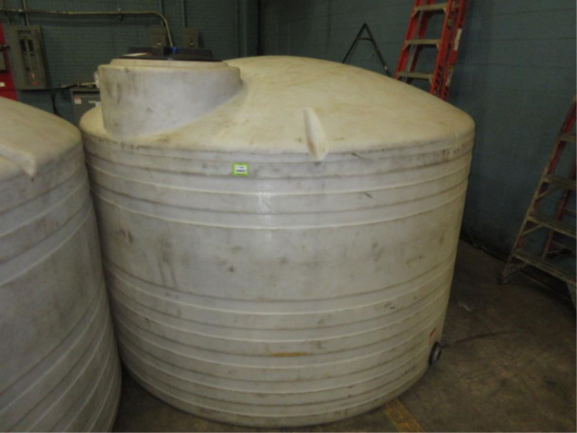 Poly Storage Tank. Poly Storage Tank, 1500 gallon capacity, 8' dia. HIT# 2179857. Loc: warehouse.