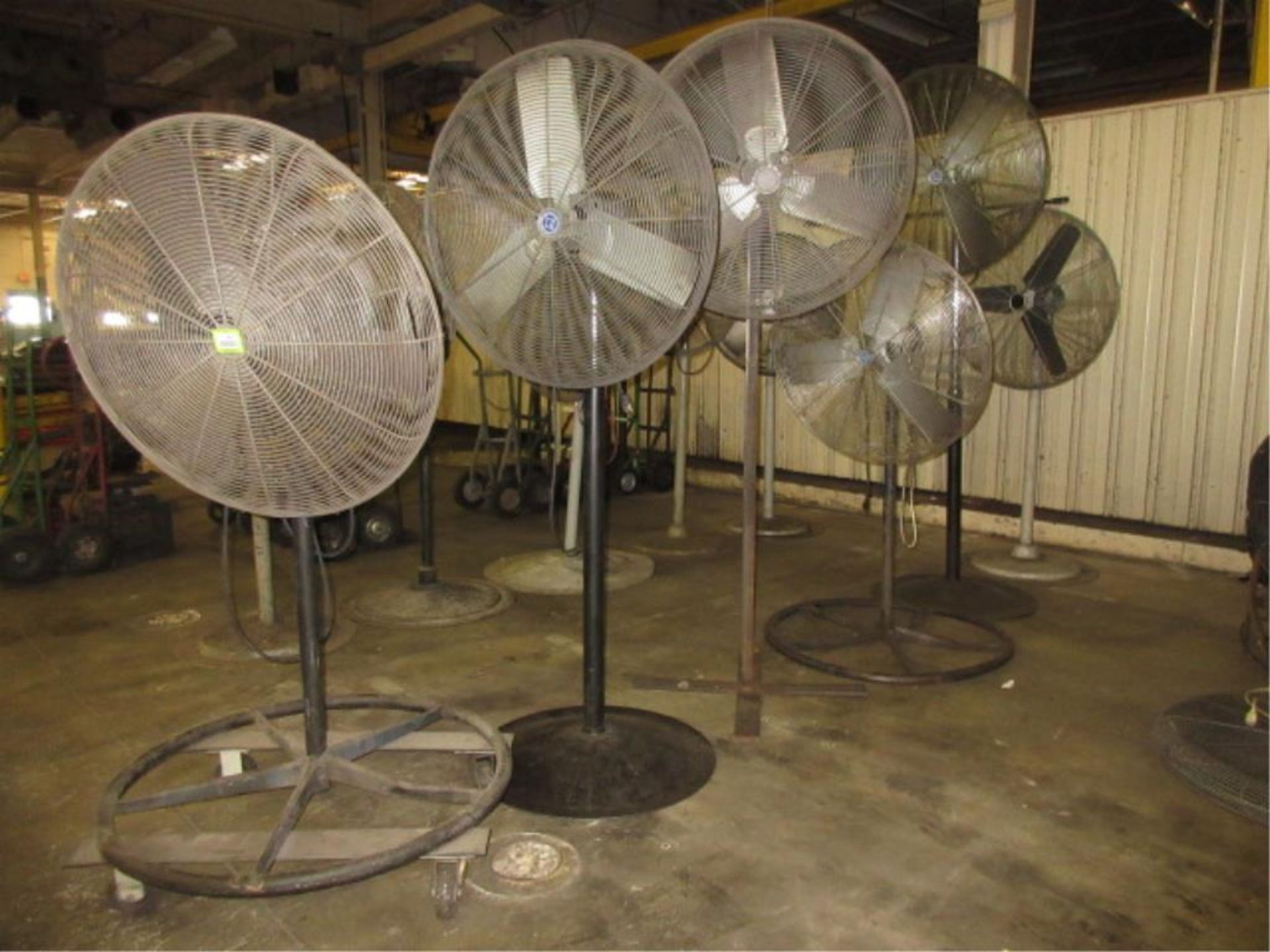 Pedestal Fans. Lot of (6) Pedestal Fans. HIT# 2179063. Loc: main floor. Asset Located at 430 West