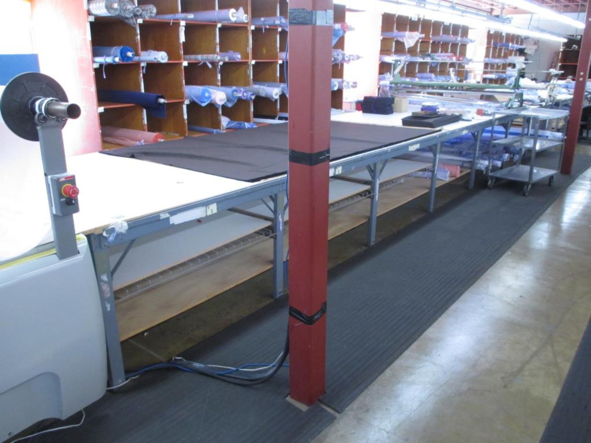 Fabric Cutting Table with Rollers. Fabric Cutting Table (28' x 67"W) with (2) Mobile Fabric Rollers,