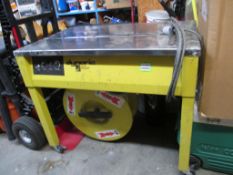 Dynaric SM-65 Strapping Machine, 65 straps per minute. SN# 30313593. HIT# 2174376. Maintenance RM.