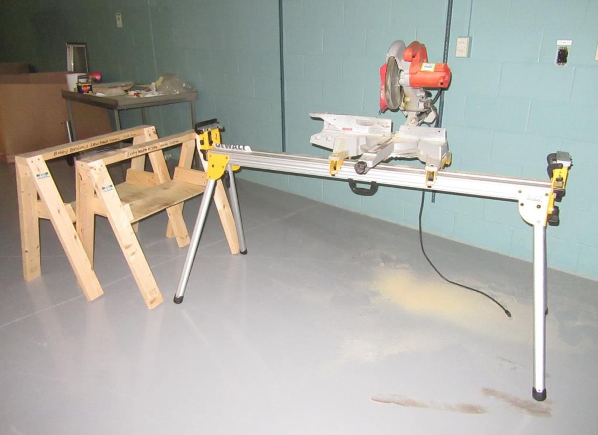 Milwaukee 6496 Miter Saw; 10" Compound Miter Saw with 72"L Stand & (2) Wooden Sawhorses. HIT#