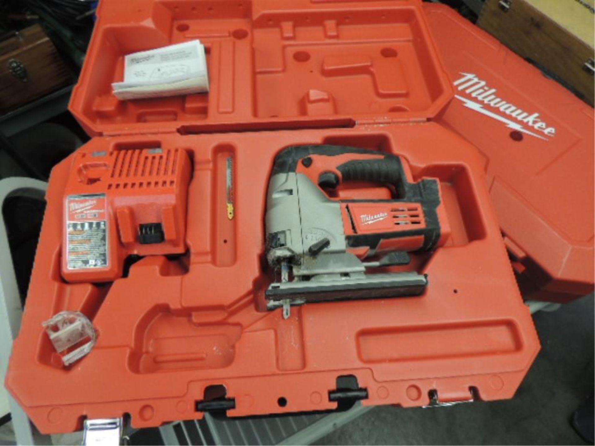 Milwaukee M18 Saw; cordless jig saw with charger NO batteries, 18v. HIT# 2192439. Loc: 901 cage.