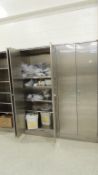 SS cabinets; Lot: (4) 35"x24"x 84", (1) 35"x18"x84", w/ contents, stainless pots, Stainless lock