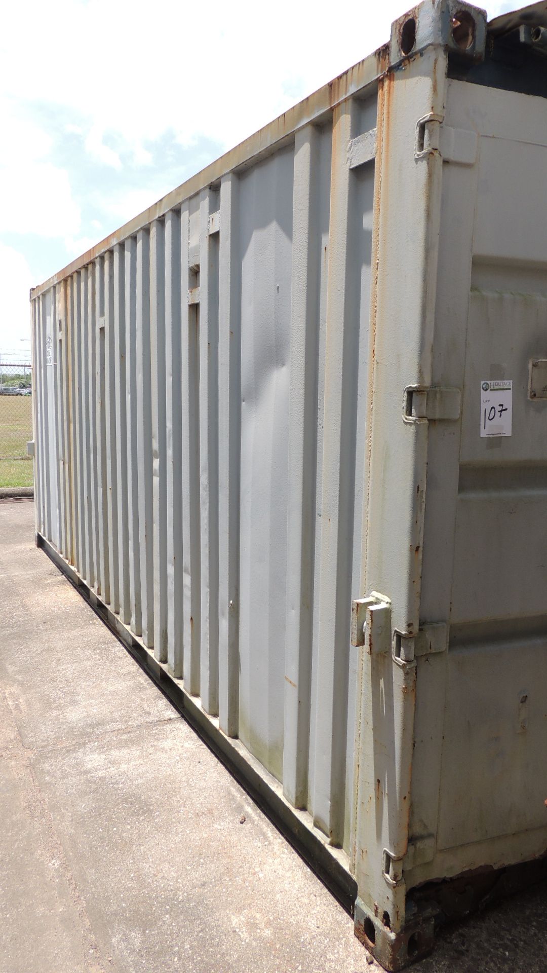 Container / Tools. Conex 20' container and contents, pipe tongs, vise, nut and bolt cabinets,