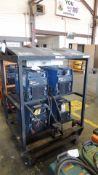 Welders. Miller XMT 304 CC/CV (4) welders in rack on casters, 230/460v, w/ Miller rack four pack.