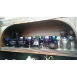 SHELF OF COLOURED TABLE GLASS