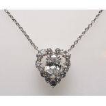 Heart-shaped pendant - Circa 2cts oval-cut diamond. Surrounded by round diamonds, [...]