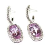 Pair of pink topaz earrings - White gold, pink topazes of 14,12cts and 84 diamonds of [...]