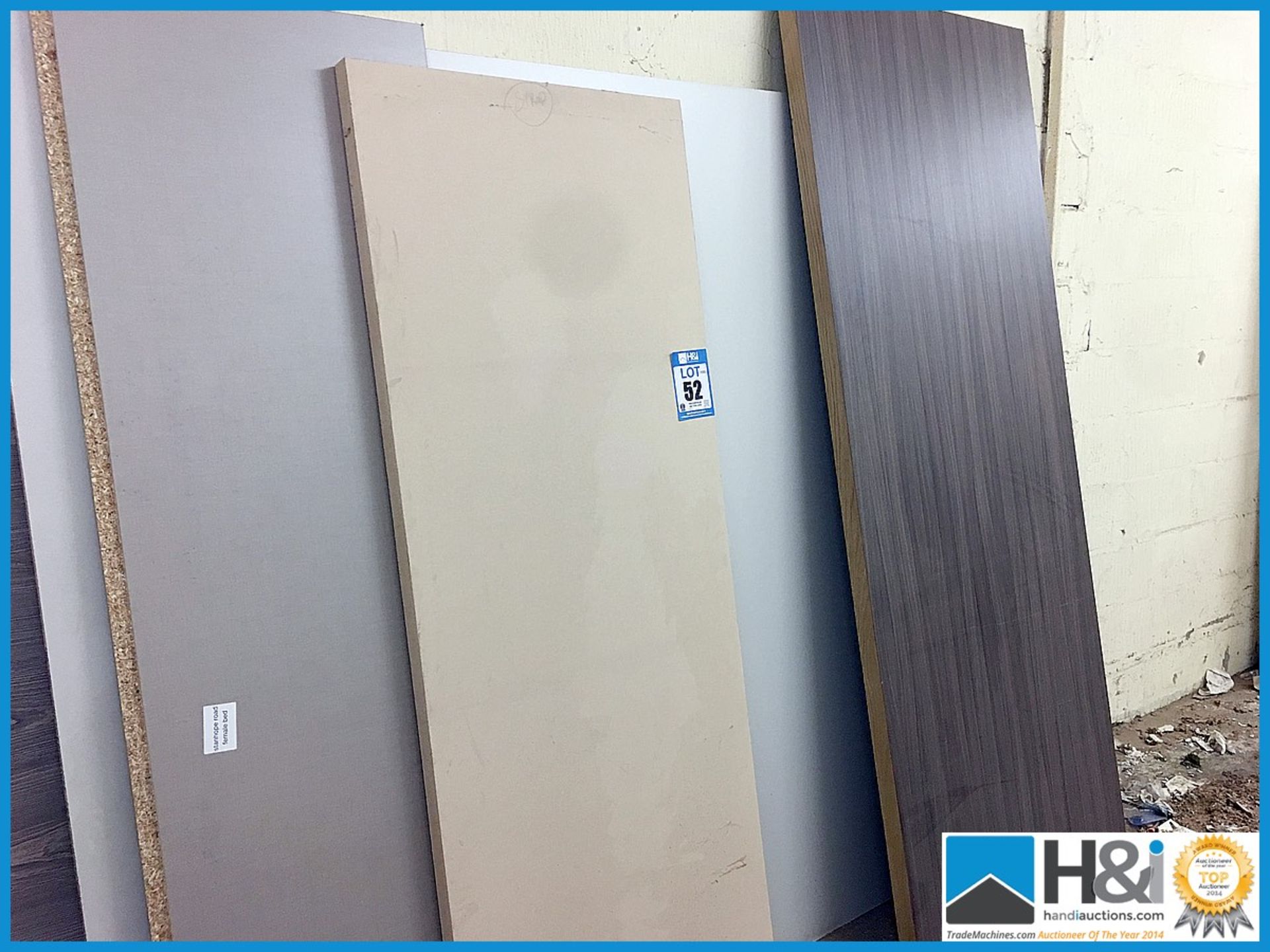 Excellent lot of large sheet materials to passage way including MDF, Corian, faced chipboard. Large,