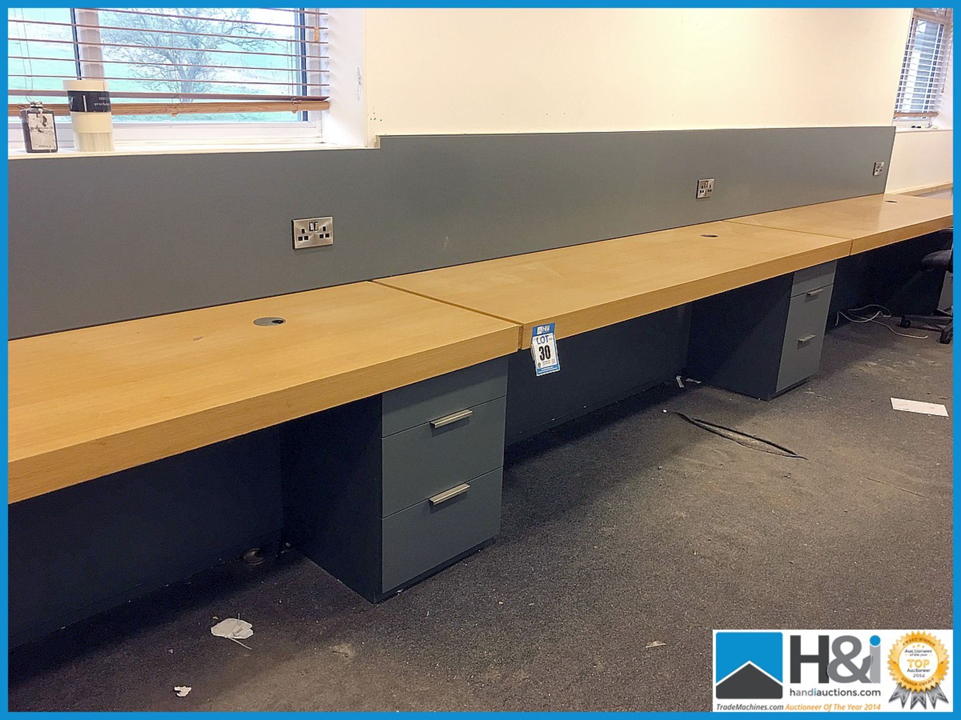 Long 3 desk assembly with drawers. Can be disassembled. Overall length 7.4m Appraisal: Used, good.