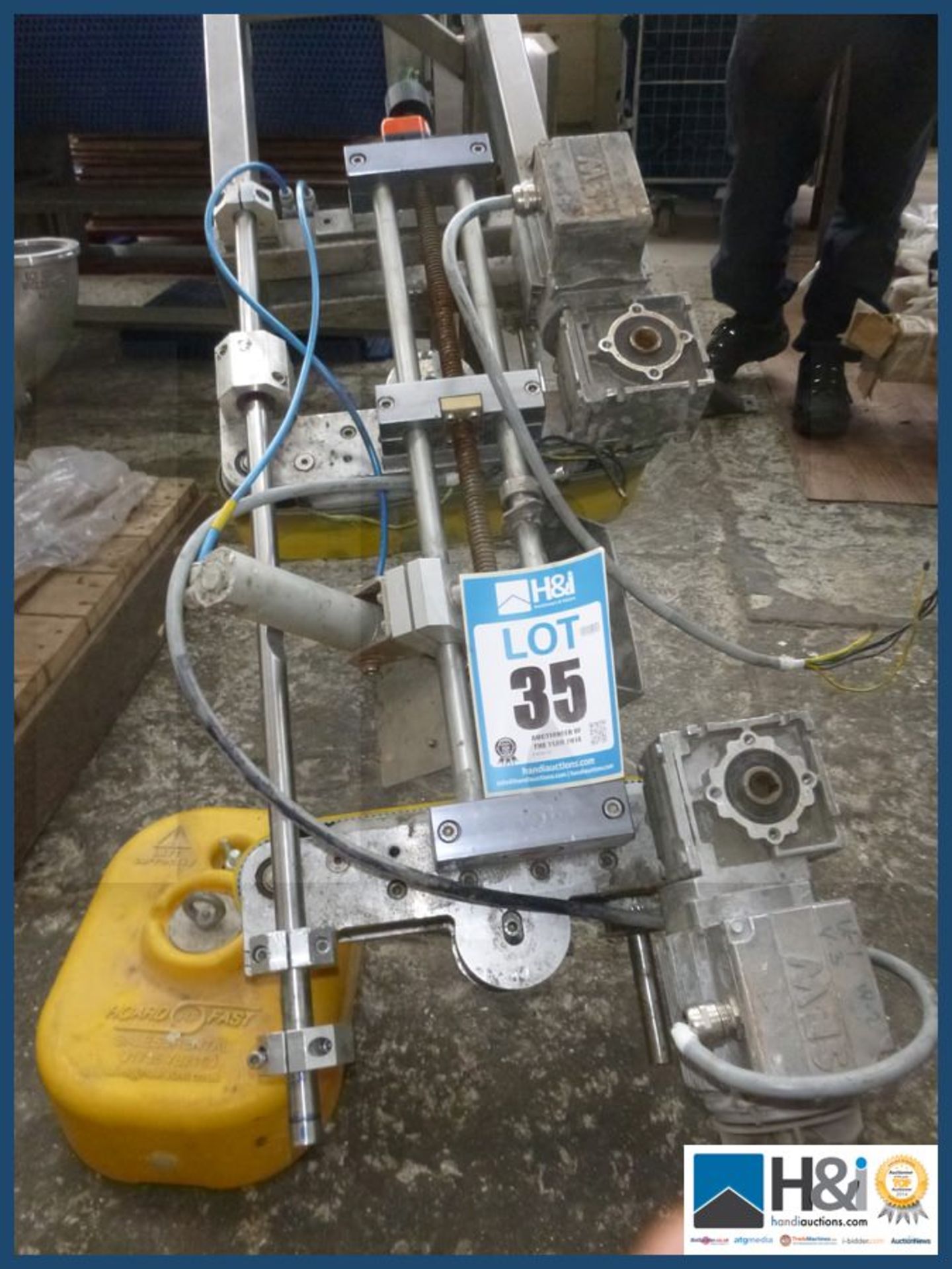Label applying machine pneumatic and electric powered stainless steel frame. Appraisal: Used,