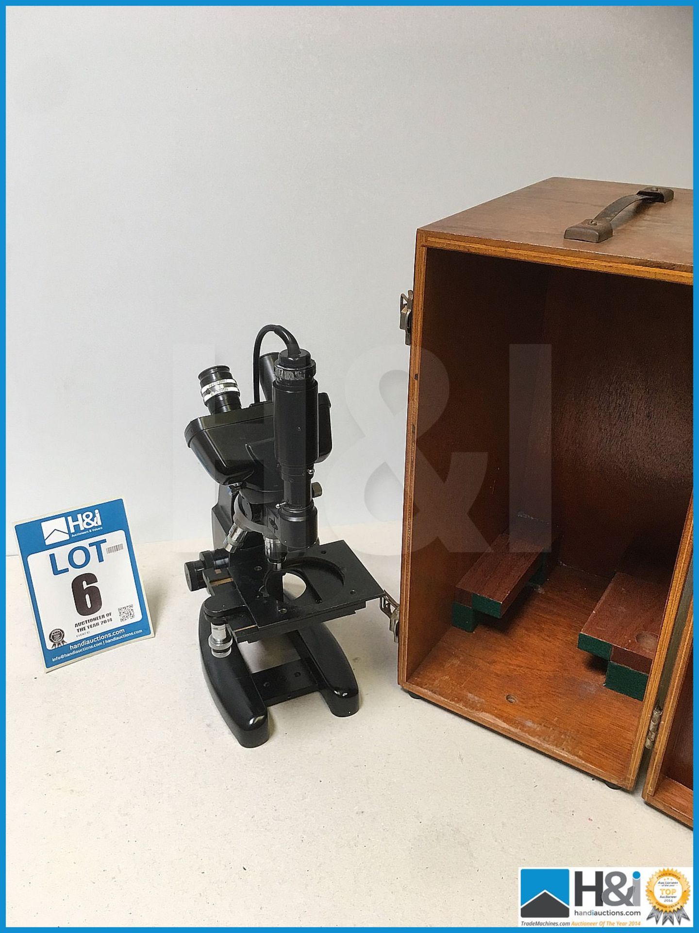 Vintage microscope in wooden case.