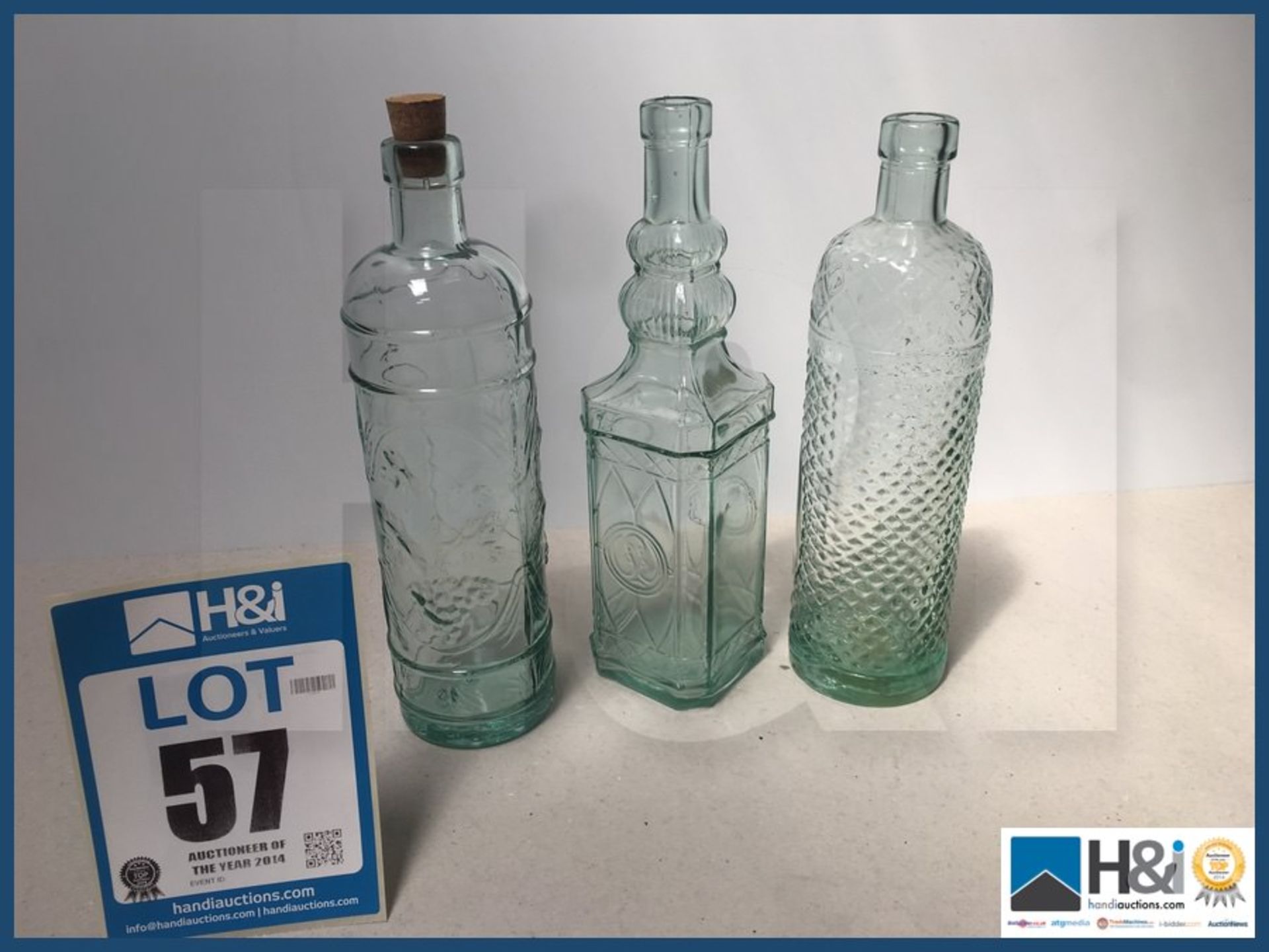 Three vintage decorative bottles.