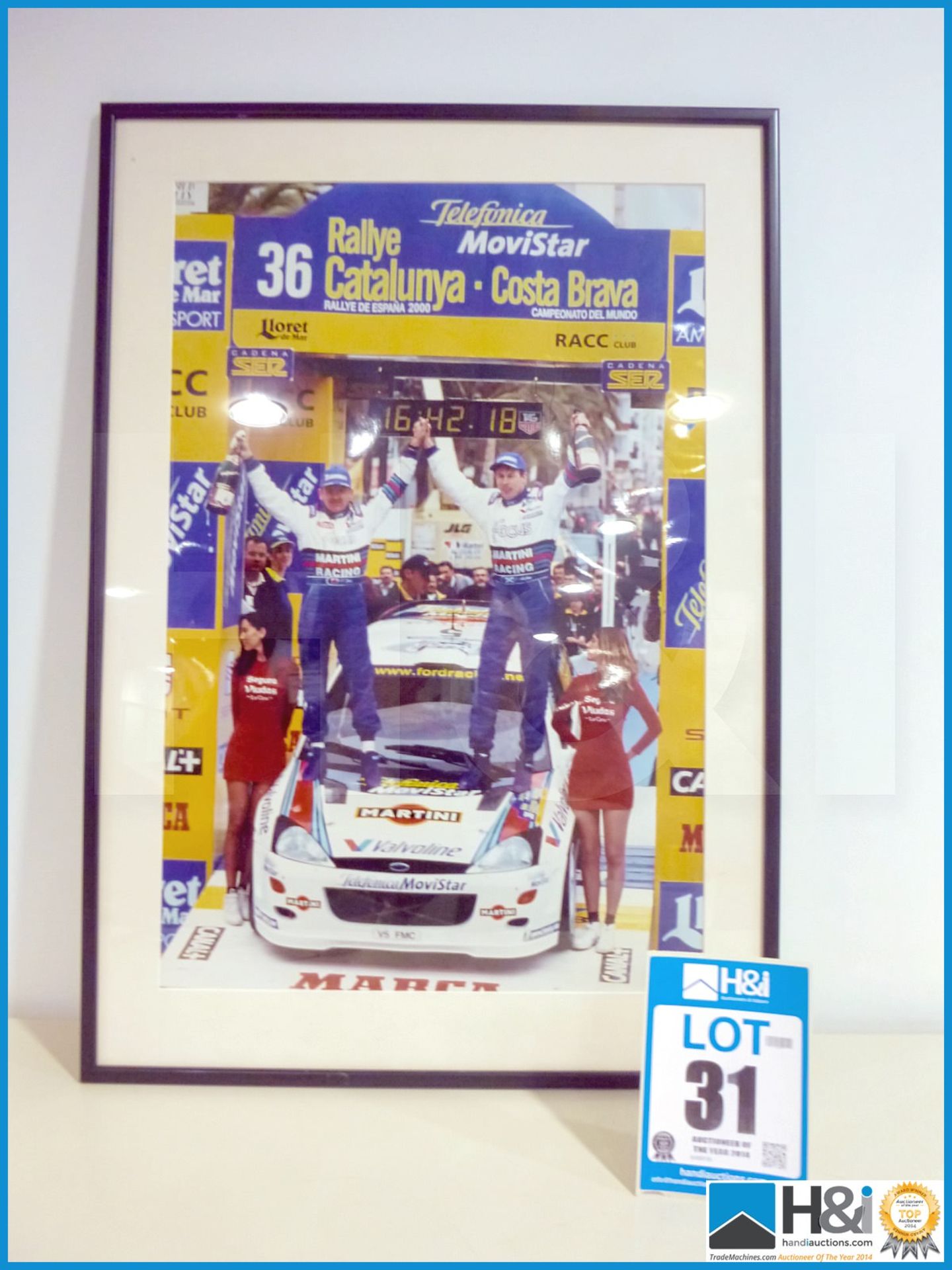 Framed print of Colin McRae and Nicky Grist Catalunya podium win. Appx 21in X 29in -- MC:N/A CILN:N/ - Image 2 of 3