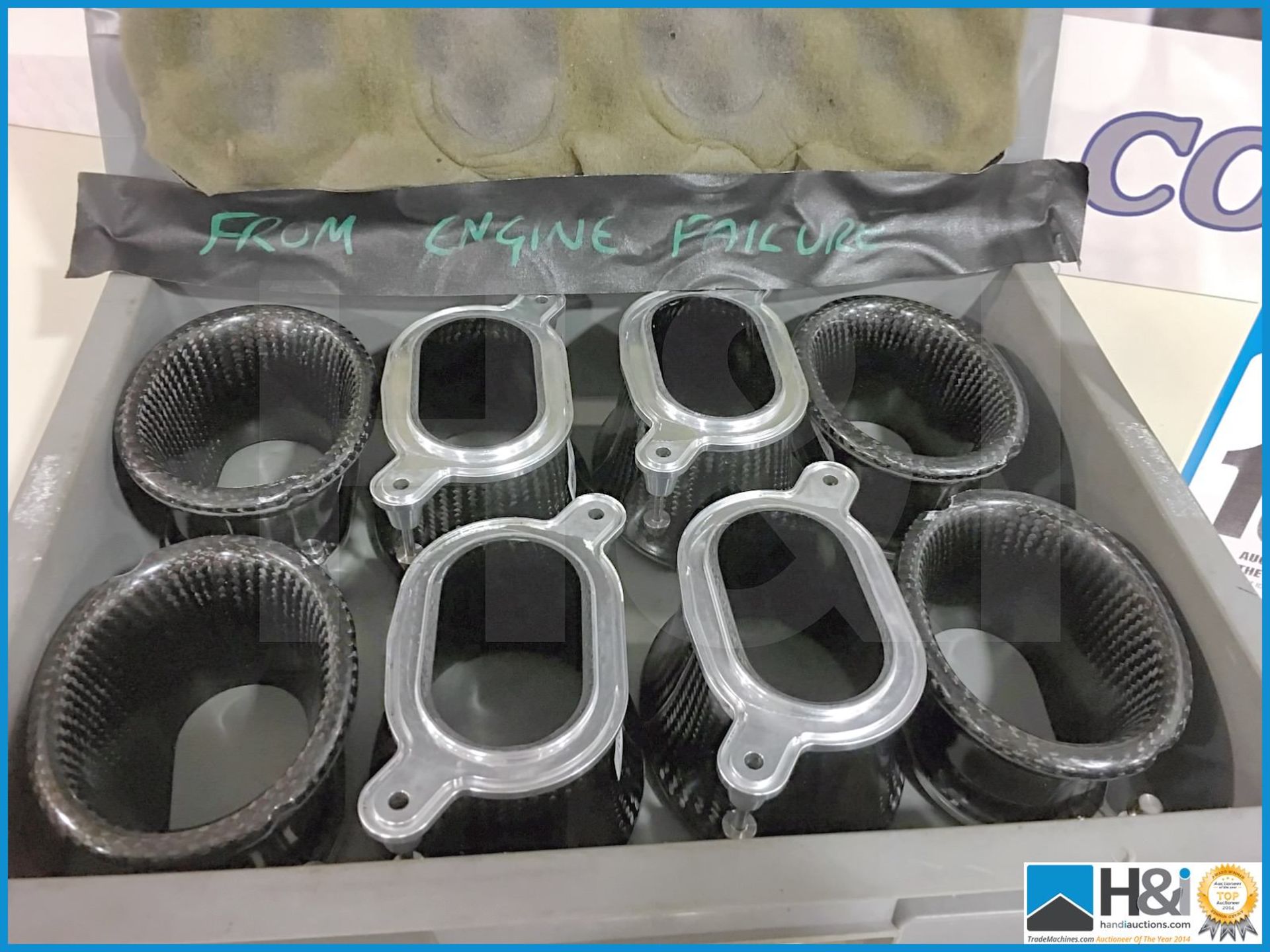 Set of 8 off carbon fibre inlet trumpets. Tape inside box reads 'from engine failure'. Lot value ove - Image 2 of 4