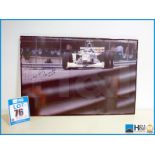 Framed photograph of Rubens Barrichello racing at what is believed to be Monaco, dated 21/10/98 sign