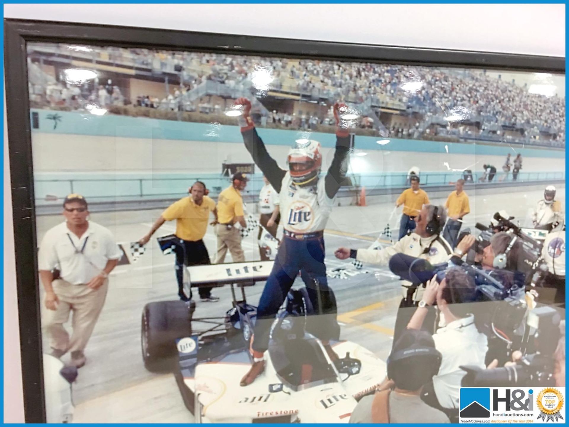 Framed photograph of Indycar race winner. Picture has minor damage. Appx 27in x 18in. From the Coswo - Image 3 of 3