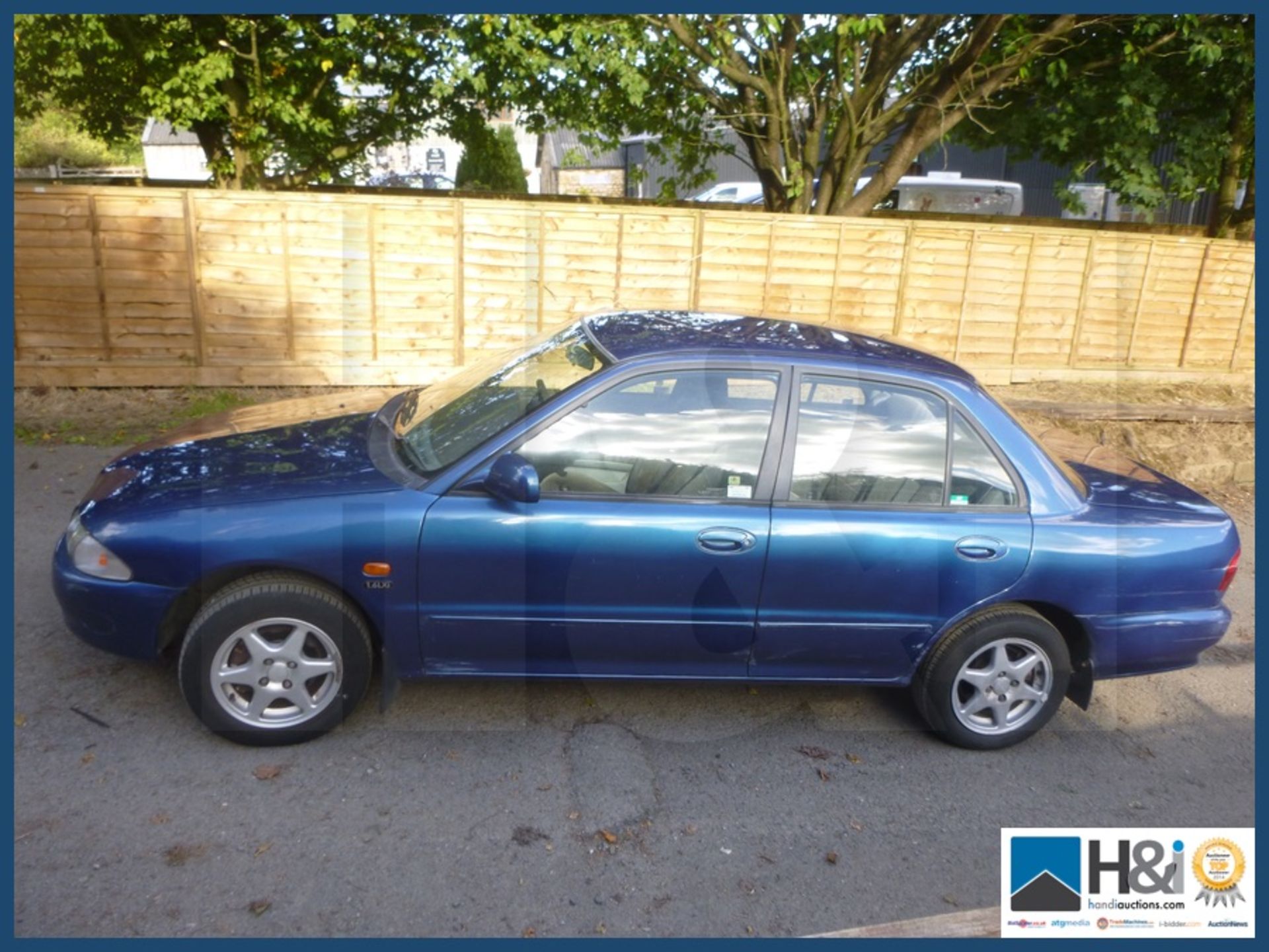 Proton Wira 1.5 petrol saloon 51 plate good runner except one brake seized on. Dog not included.