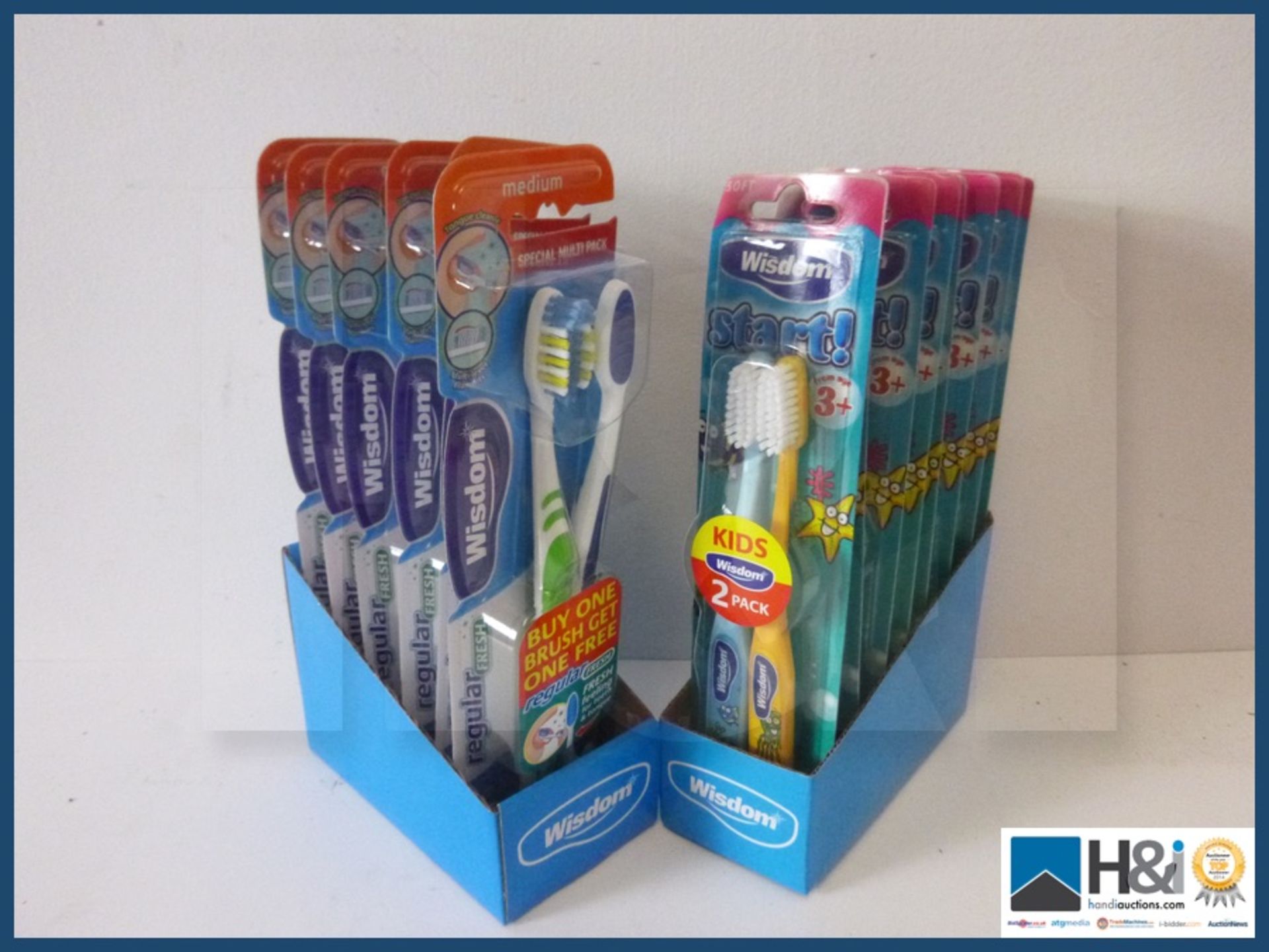 Lot of new Wisdom toothbrushes 6 adult twin packs and 6 children's twin packs .