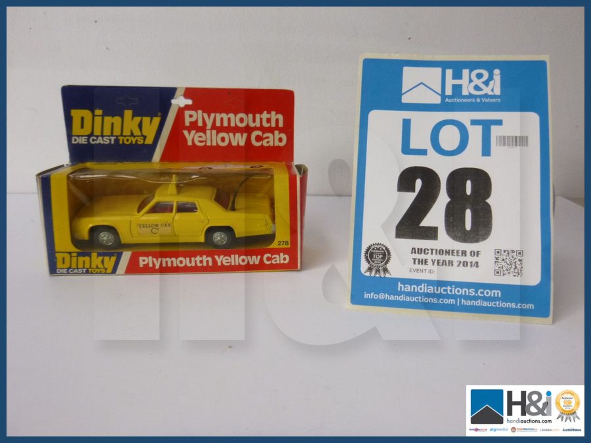 Dinky plymouth yellow cab.