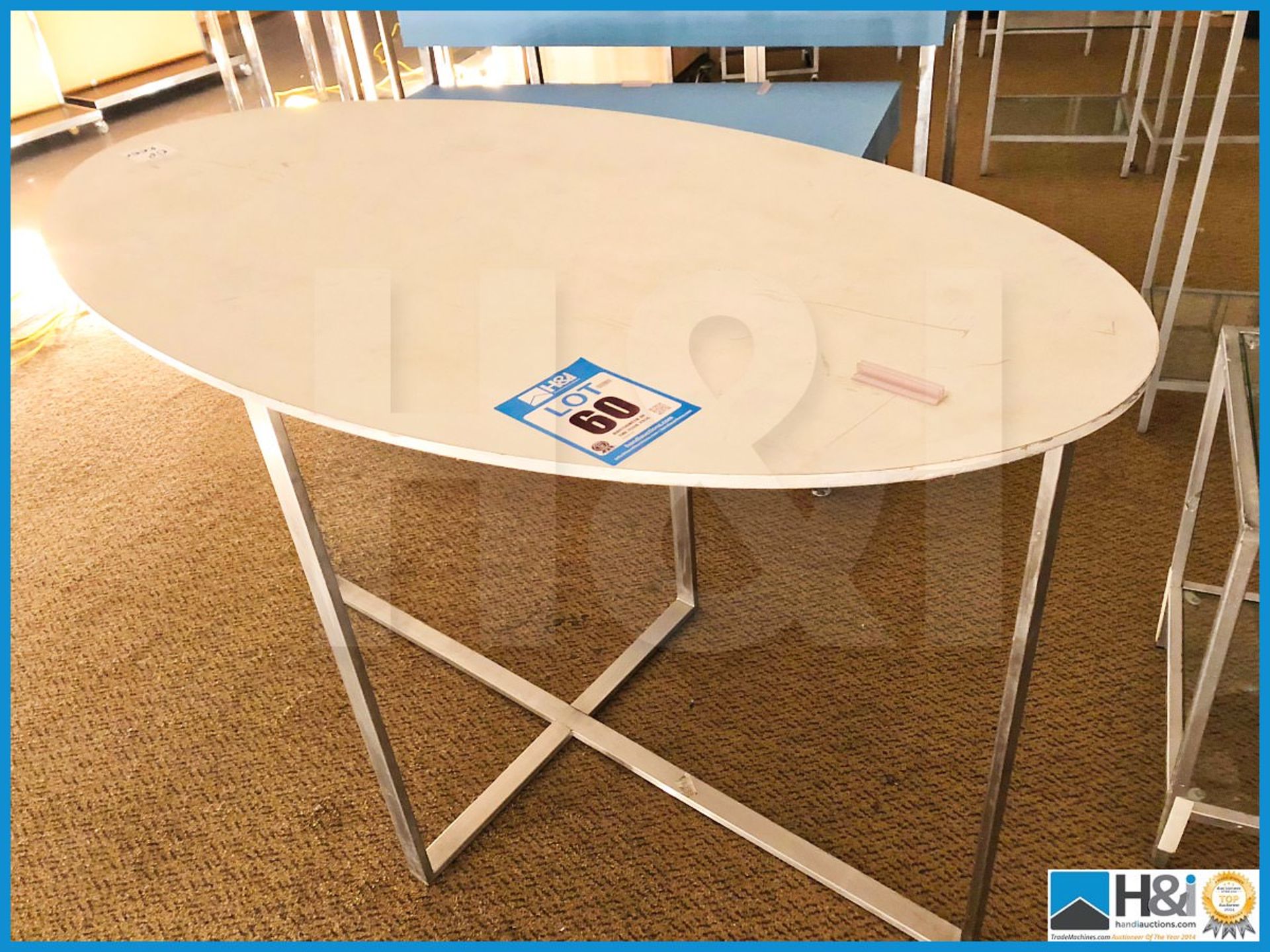 Ovel tall table with stainless steel.