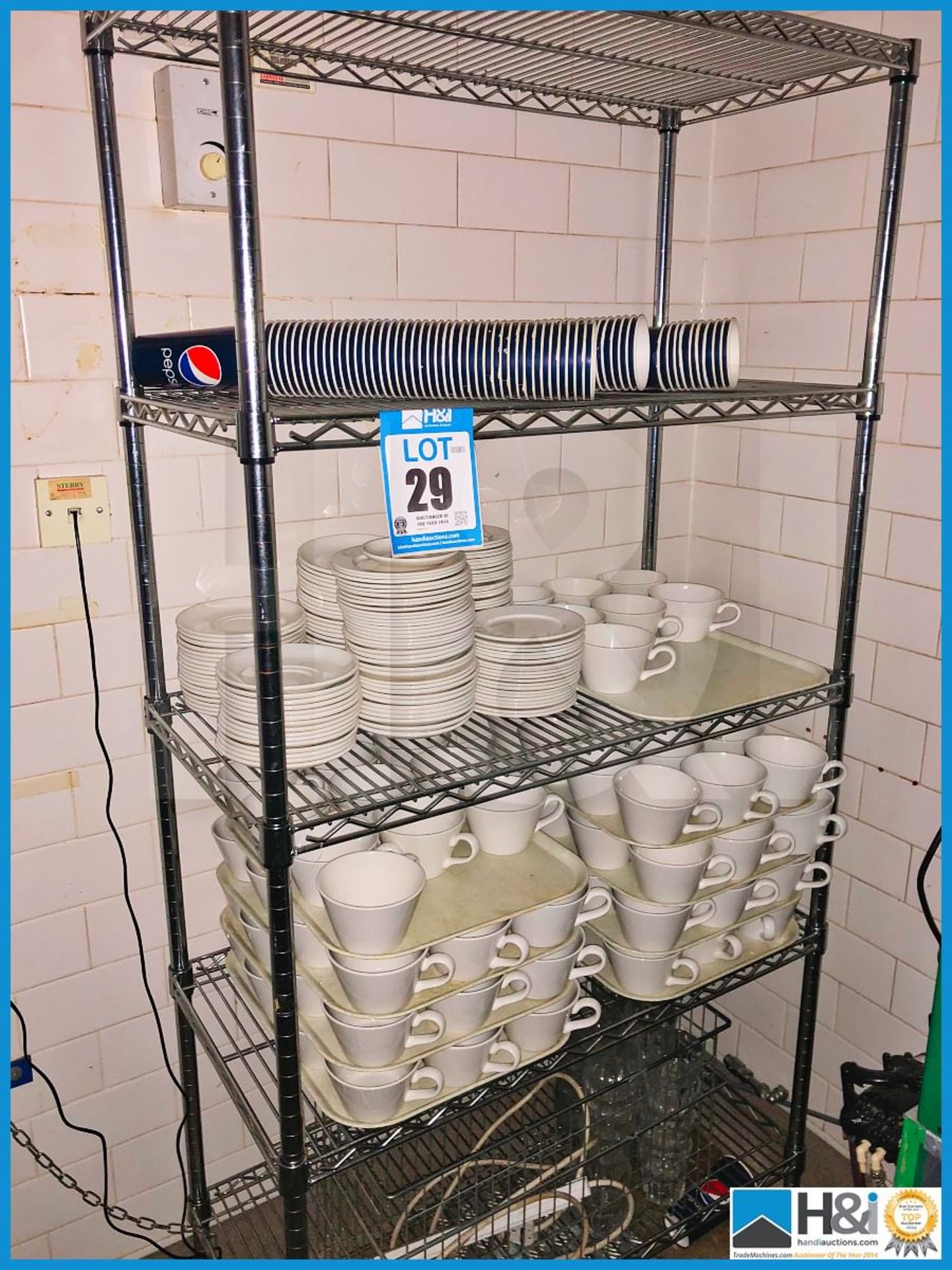 Freestanding rack with huge quantity of very nice crockery crockery.